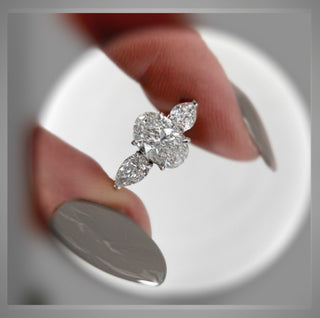 3.30 Carat Three Stone Oval Diamond Engagement Ring With Pear Diamond side Diamonds *** By Chelsea Leigh and Company