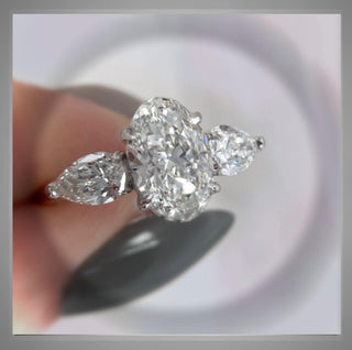 3.30 Carat Three Stone Oval Diamond Engagement Ring With Pear Diamond side Diamonds *** By Chelsea Leigh and Company