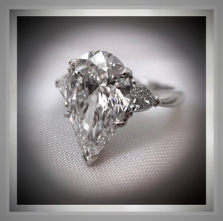 4.70 Carat Three Stone Pear Shaped Diamond Engagement Ring With Pear Diamond side Diamonds  By Chelsea Leigh and Company