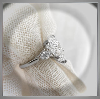 4.70 Carat Three Stone Pear Shaped Diamond Engagement Ring With Pear Diamond side Diamonds  By Chelsea Leigh and Company